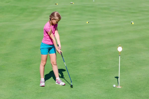 girl playing tcr golf program